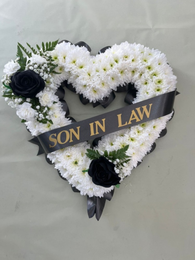 Open Based heart with sash - A traditional floral tribute in the shape of a heart, with ribbon and matching top spray. 

Ribbon and top spray available in a variety of colours.

Sash included - please specify your 'word' of choice in special requests.