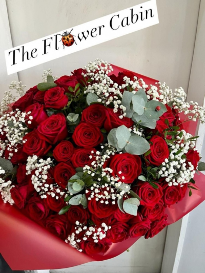 50 shades of red - 50 luxury red roses with gyp and foliage handtied and wrapped.